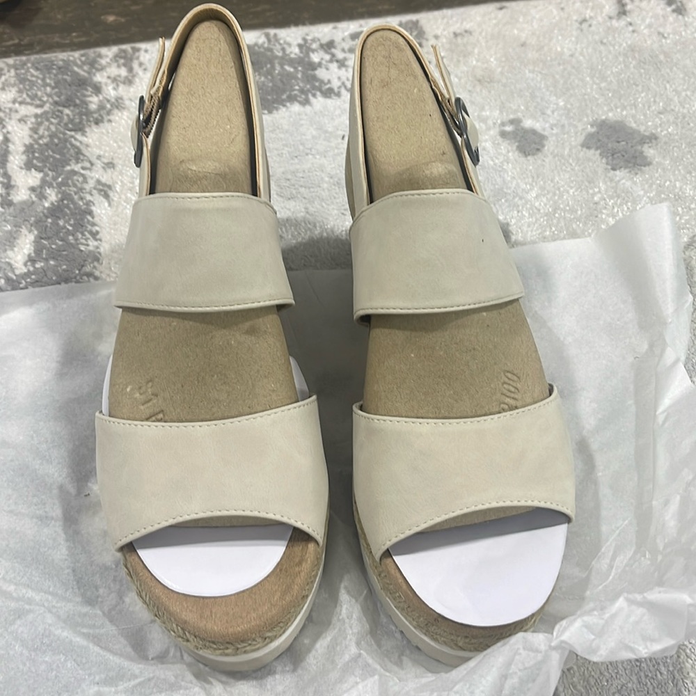 Brand new sandals, white heel with nude stripes.
